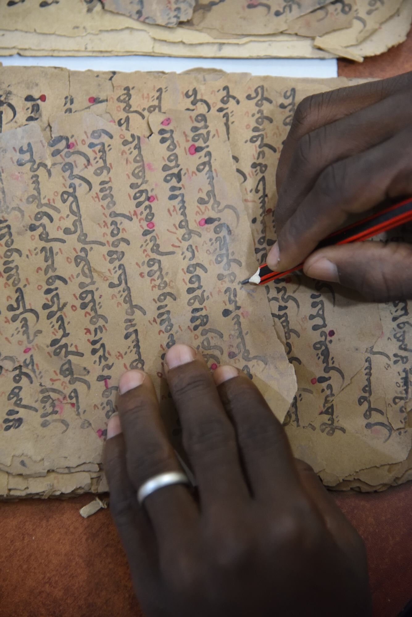 Collating manuscripts before digitization at SAVAMA-DCI, Bamako